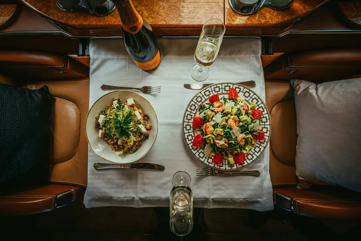 Lunch for two served on a private jet table, seen from above